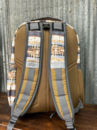 Backpack with patterned straps on a wooden surface