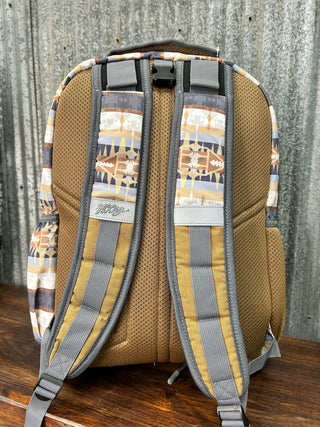 Brown and gray bag with patterned straps on a wooden surface