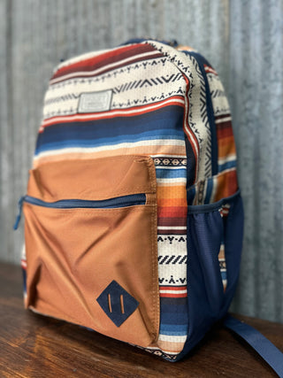 Backpack with tribal pattern on a wooden surface