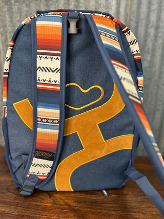 Backpack with colorful design on a wooden surface