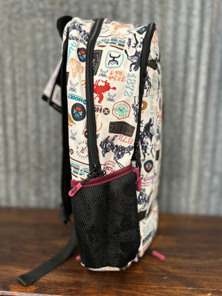 Backpack with colorful pattern on a wooden surface and metal background