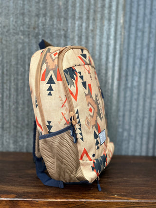Backpack with geometric pattern on a wooden surface and textured wall background