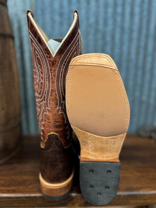 Close-up of a brown cowboy boot with intricate detailing on the insole.
