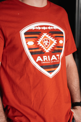 Red t-shirt with Ariat logo worn by a person