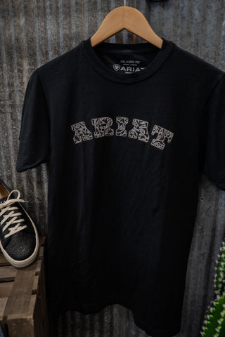 Black t-shirt with 'Aria' logo on a wooden hanger against a rustic background