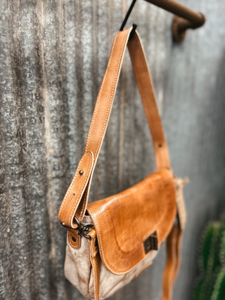 Brown leather bag with a textured background