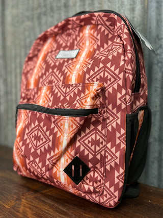 Backpack with geometric pattern on a wooden surface and gray background
