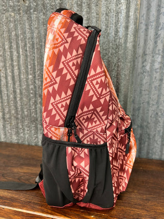 Fanny pack with red geometric pattern on a textured surface