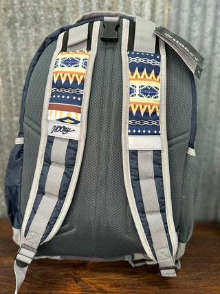 Gray backpack with patterned straps on a wooden surface