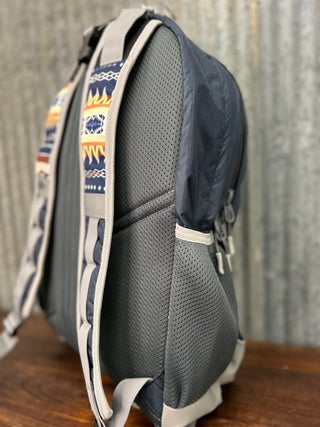 Gray backpack with patterned shoulder straps on a wooden surface.
