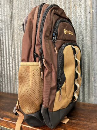 Brown and beige backpack on a textured surface