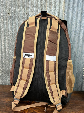 Brown and black bag with visible brand logo on a textured surface