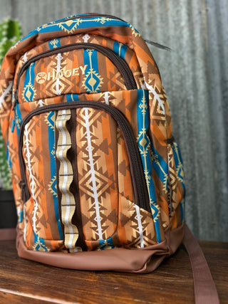 Backpack with tribal pattern on a wooden surface