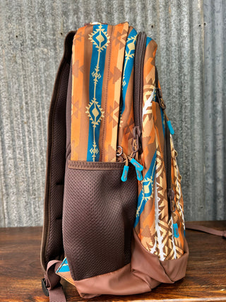Multicolored patterned bag with brown accents on a textured surface