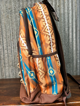 Wristlet with tribal pattern on a textured surface