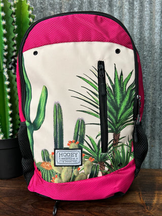 Backpack with cactus and palm tree design on a pink background