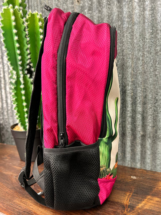 Pink bag with a cactus design on a wooden surface