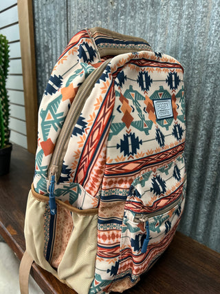 Backpack with tribal pattern on a wooden surface