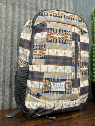Backpack with geometric pattern on a wooden surface