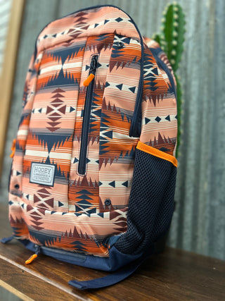Backpack with geometric pattern on a wooden surface