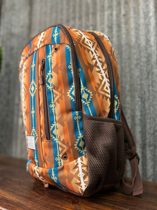 Backpack with tribal pattern on a wooden surface