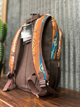 Backpack with patterned straps on a wooden surface