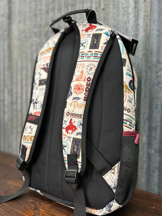 Backpack with patterned design on a wooden surface and gray background