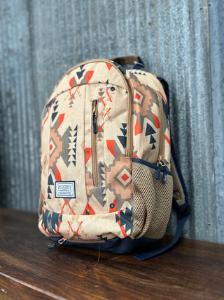Backpack with geometric pattern on a wooden surface and metal wall background