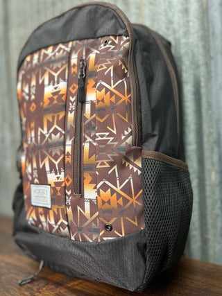 Backpack with a patterned side panel on a wooden surface