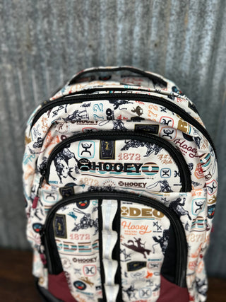 Backpack with a pattern of logos and text on a gray background