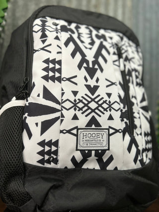 Backpack with black and white geometric pattern and 'HOOey' branding.