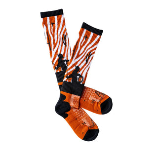 Pair of socks with zebra pattern and black accents on a white background