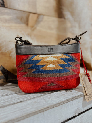Small pouch with geometric pattern on a wooden surface