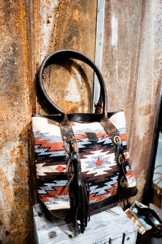 Handbag with tribal pattern on a textured surface