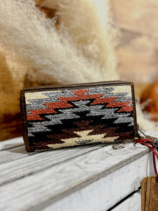 Handmade wallet with geometric pattern on a wooden surface