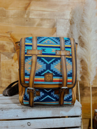 Handbag with a colorful geometric pattern on a wooden surface