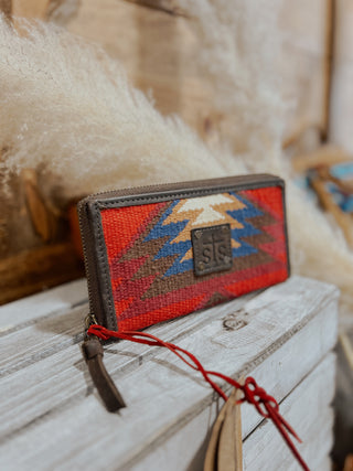 Handcrafted wallet with geometric pattern on a wooden surface