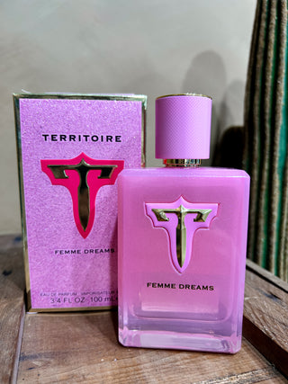 Territoire Femme Dreams perfume bottle and packaging on a wooden surface