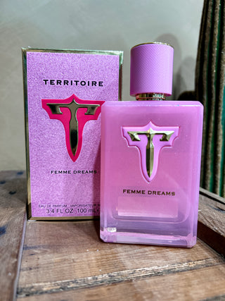 Territoire Femme Dreams perfume bottle and packaging on a wooden surface
