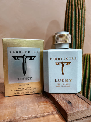 Territoire Lucky perfume bottle and packaging on a wooden surface with a cactus in the background
