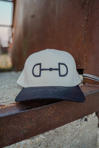 Cap with a logo on a metal surface