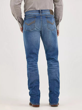 Person wearing blue jeans on a white background