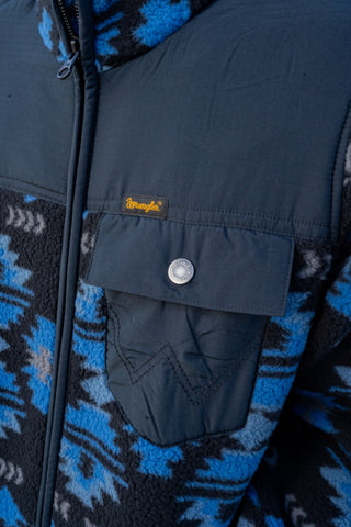 Close-up of a blue and black patterned jacket with a brand label.